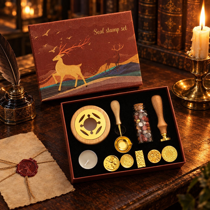 Retro elk wax seal gift set open on an antique desk by candlelight, with a quill, inkwell and a wax-sealed letter